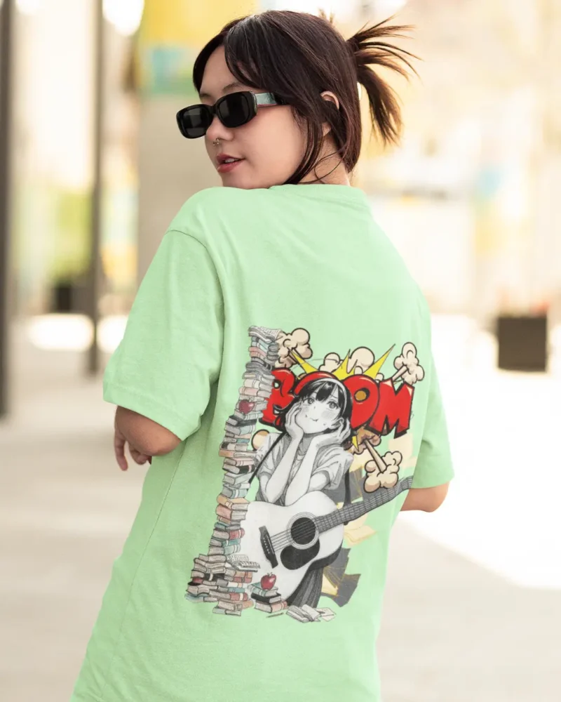 Oversized streetwear t-shirt featuring manga girl with guitar, books, and comic pop-art explosion background.