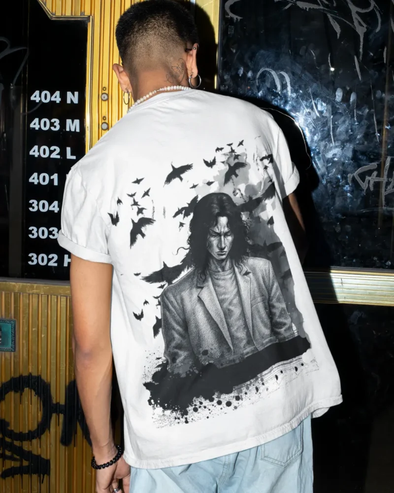 Oversized streetwear t-shirt featuring manga-inspired figure with crows and rising shadows in monochrome design.